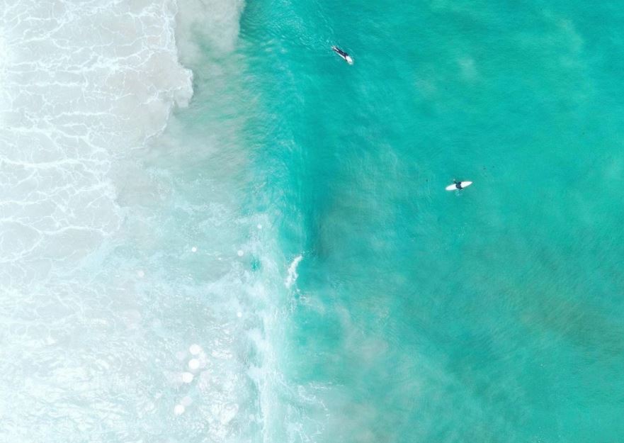 Drone photograph above surfers in the Western Cape, South Africa. Photo by Mitch Glover Photography